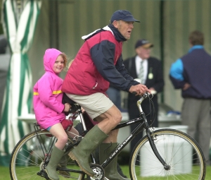 Harry Parker carrying his daughter Abigail on the back of his bike at Henley in 2002.